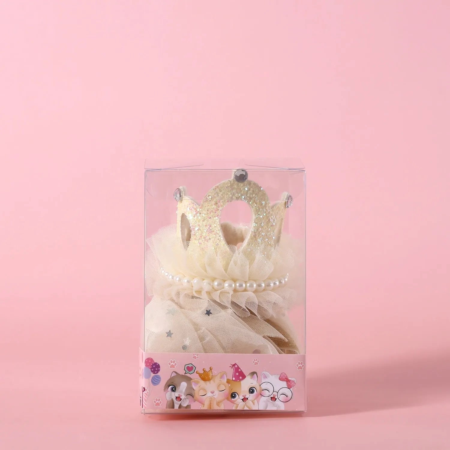 A beige and a pink princess crown headdress for cats on a white background.