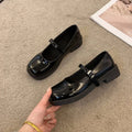 Women's solid colour French vintage flat shoes with round toe in red, light black, or matte black.