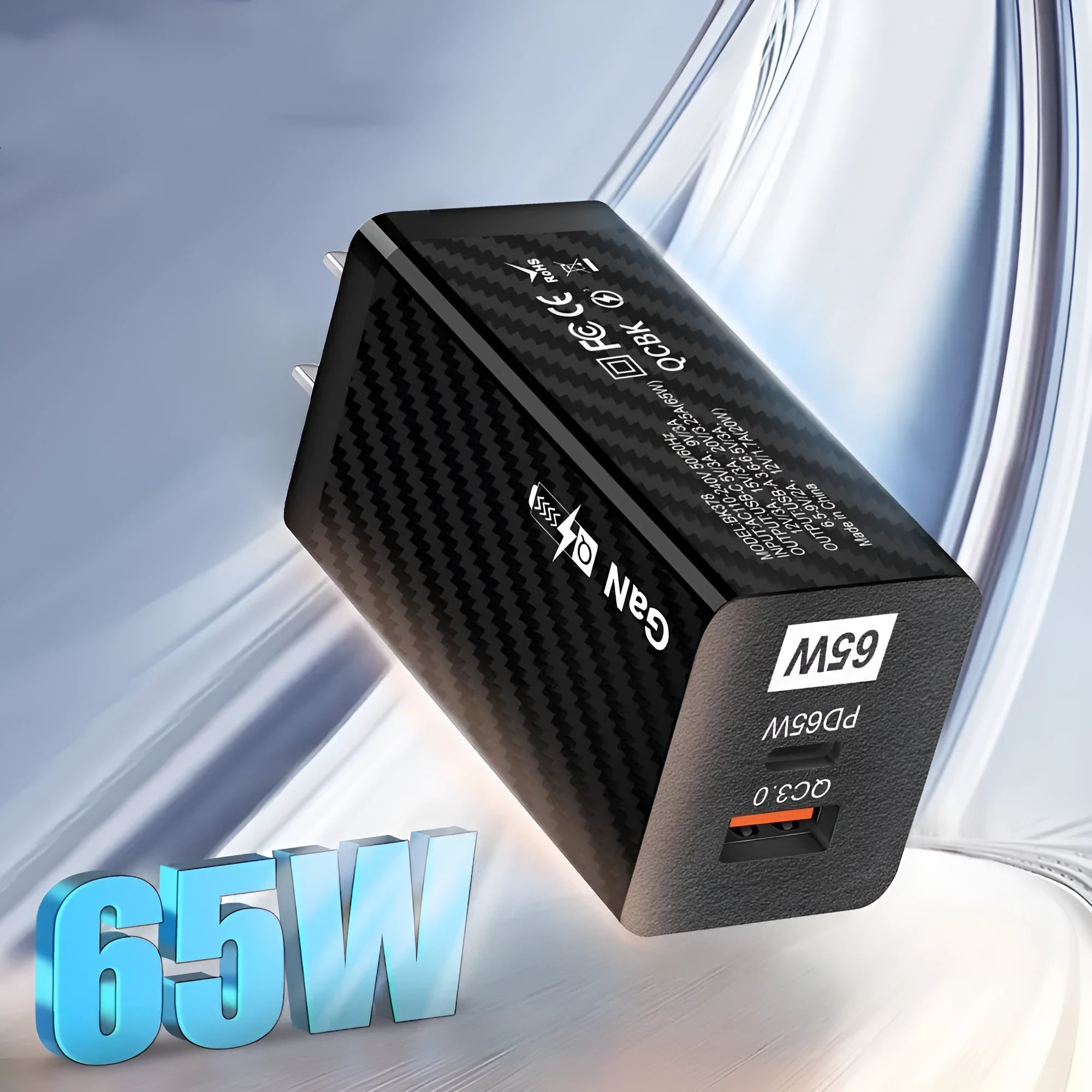 White and black 65W GaN universal laptop charger with USB-C port showing EU, UK, and US plug options
