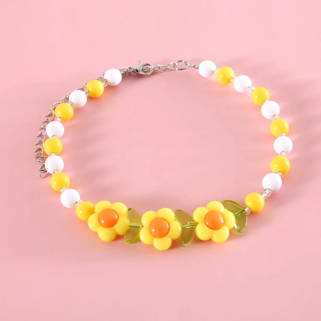 Colourful bead pet necklace for dogs and cats in rainbow, peach, or small flower patterns with adjustable sizing