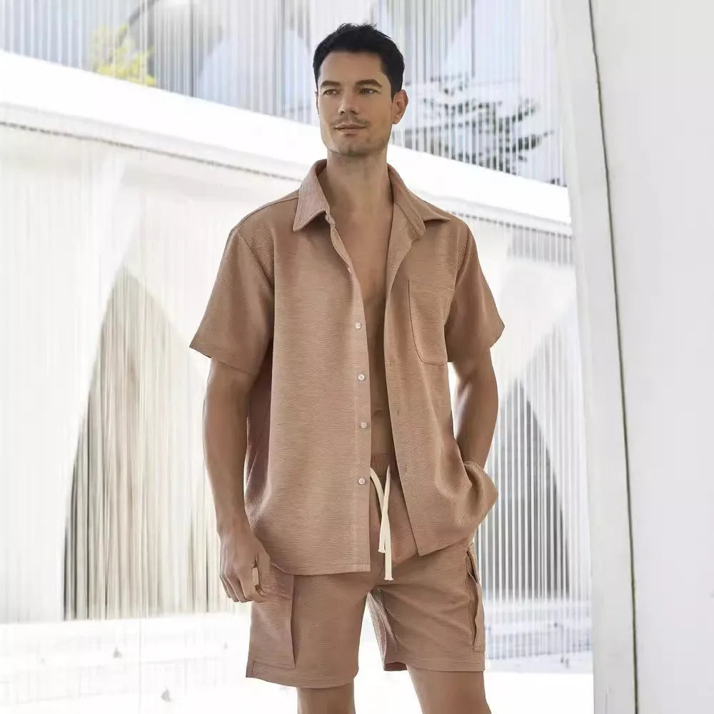 Women's beige polyester shorts set with short sleeve top and elastic waist shorts laid flat.