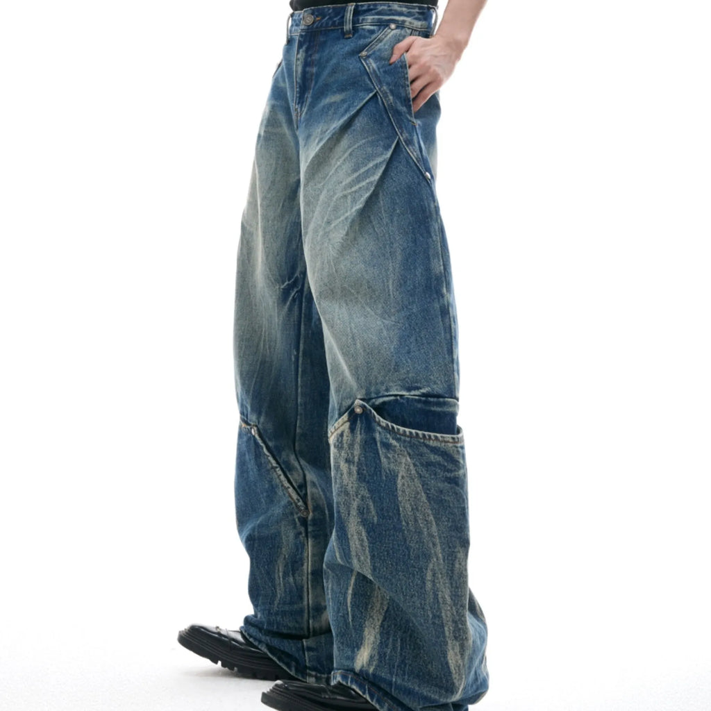 Men's retro washed burst pattern jeans in verdant blue with loose fit and curved knife style.