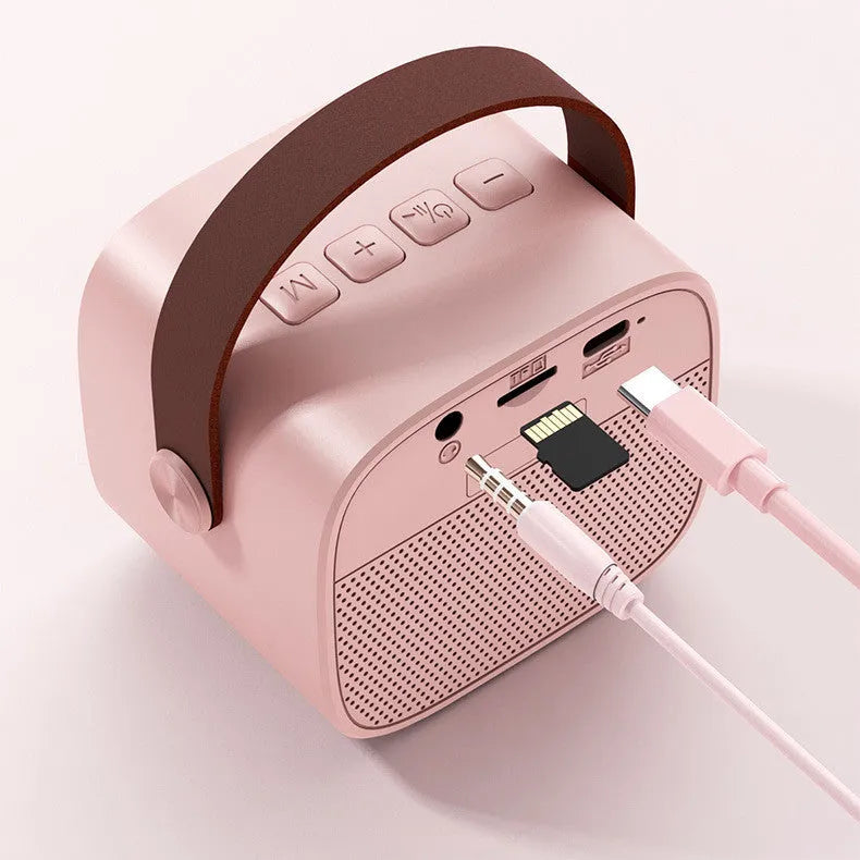Wireless Bluetooth portable speaker with microphone in white plastic shell, 8x6.5x7 cm size, with USB charging port