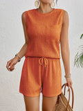 Women's apricot coloured sleeveless vest and shorts set on a hanger