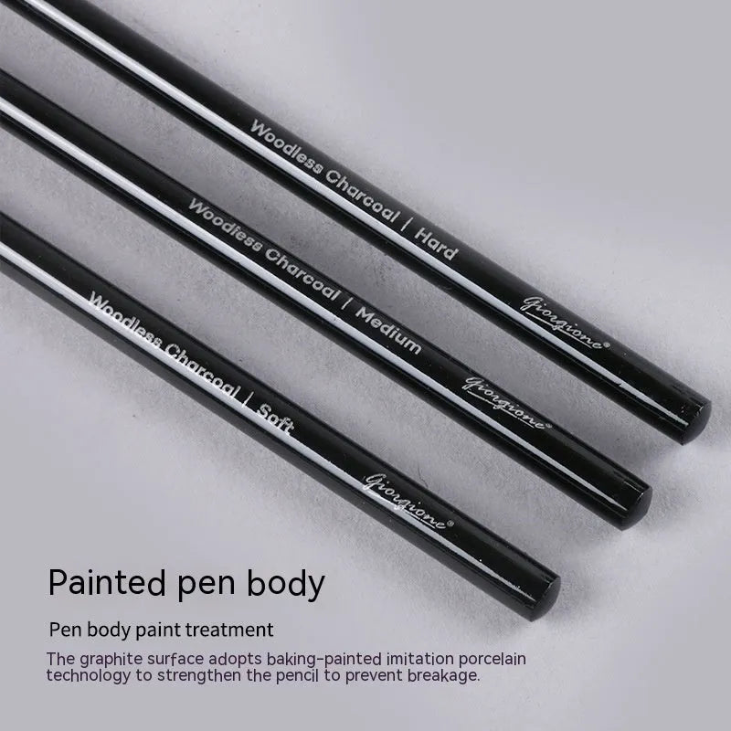 Set of nine graphite and carbonised wooden drawing pencils displayed on a suction card packaging.