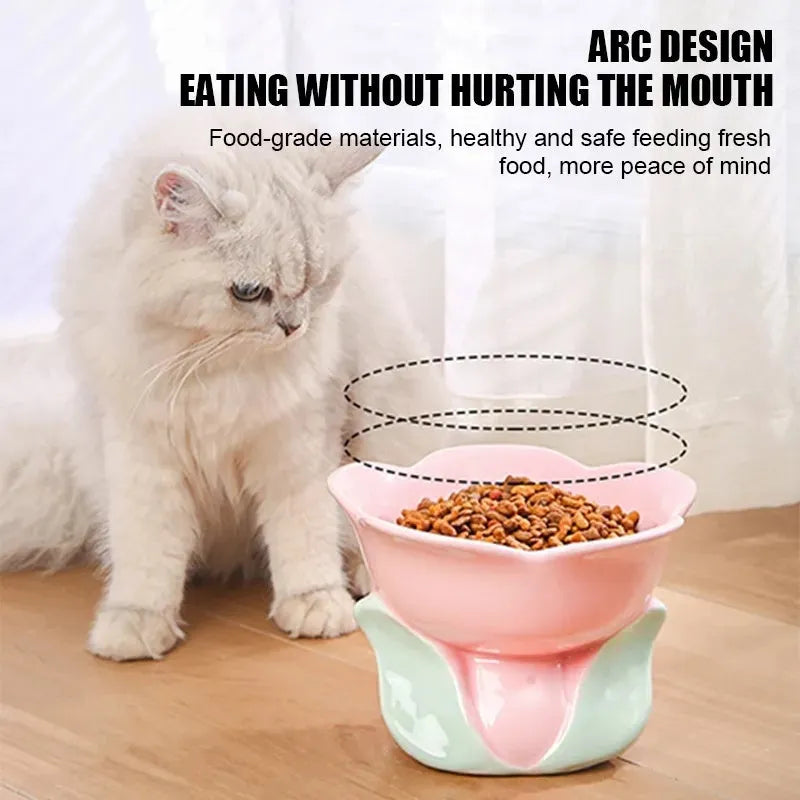 Blue ceramic pet bowl with floral pattern, raised on a non-slip base for cat or small dog feeding.