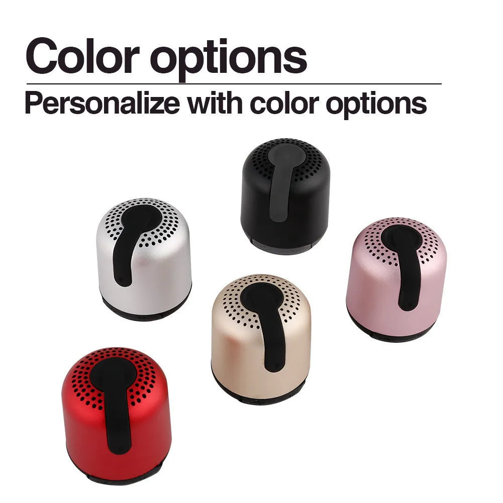 Hieha XQ11 cylindrical mini Bluetooth speaker in silver metal finish, showing compact size.