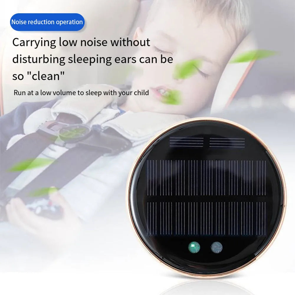 Black solar-powered car air humidifier mounted on a vehicle's air conditioning vent.
