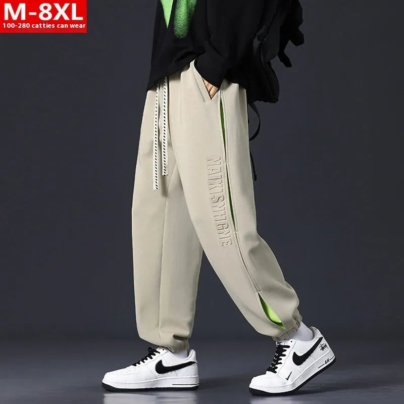 Men's cotton trousers with ankle bands and stitching detail in grey green colour