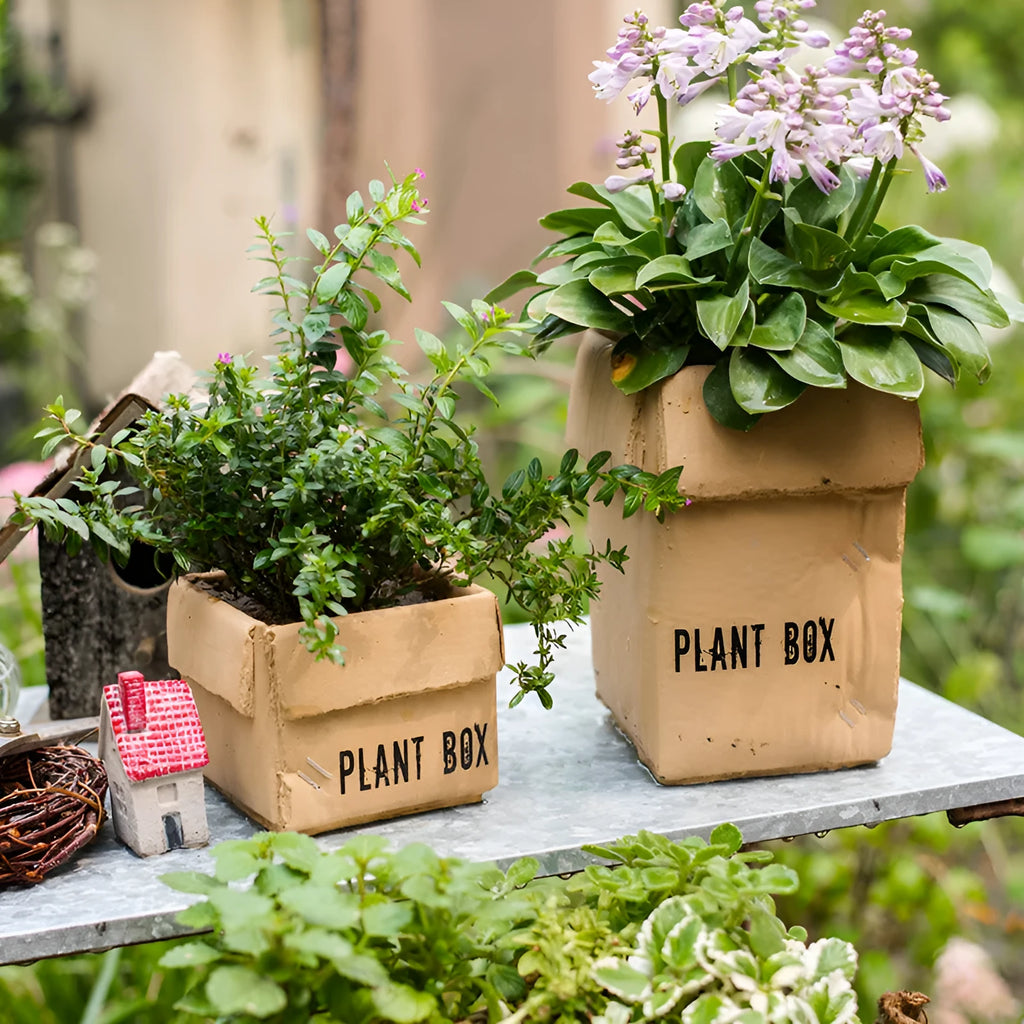 Cement flowerpot with brown paper box design and drainage holes for indoor planting