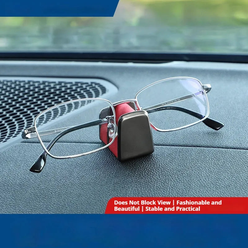 Green zinc alloy and leather glasses clip holder for car dashboard.