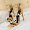 Open-toe high heel shoe with an ankle strap and buckle, shown in one of six available solid colours.