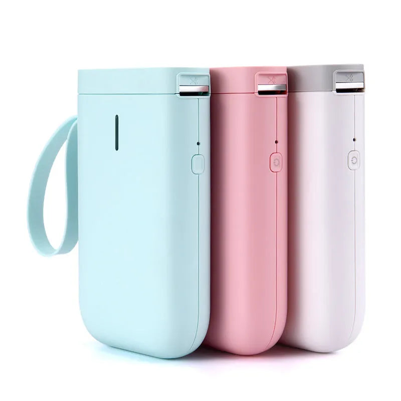D11 Bluetooth thermal label printer in black, white, pink, or green, shown next to a smartphone running the label design app.