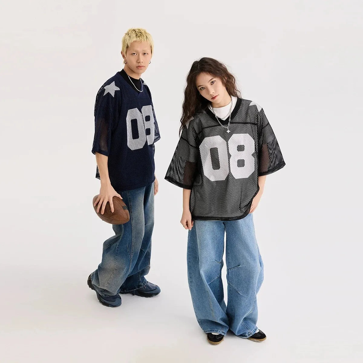 Loose fit black half sleeve pullover shirt with white letter pattern design on the front.