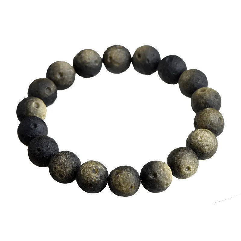 Obsidian crater ball bracelet in silver stone meteorite colour with textured round beads.
