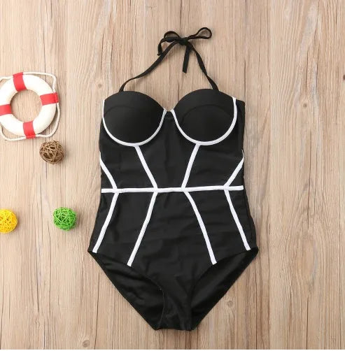 Black one-piece women's swimsuit on display, available in sizes S to XL