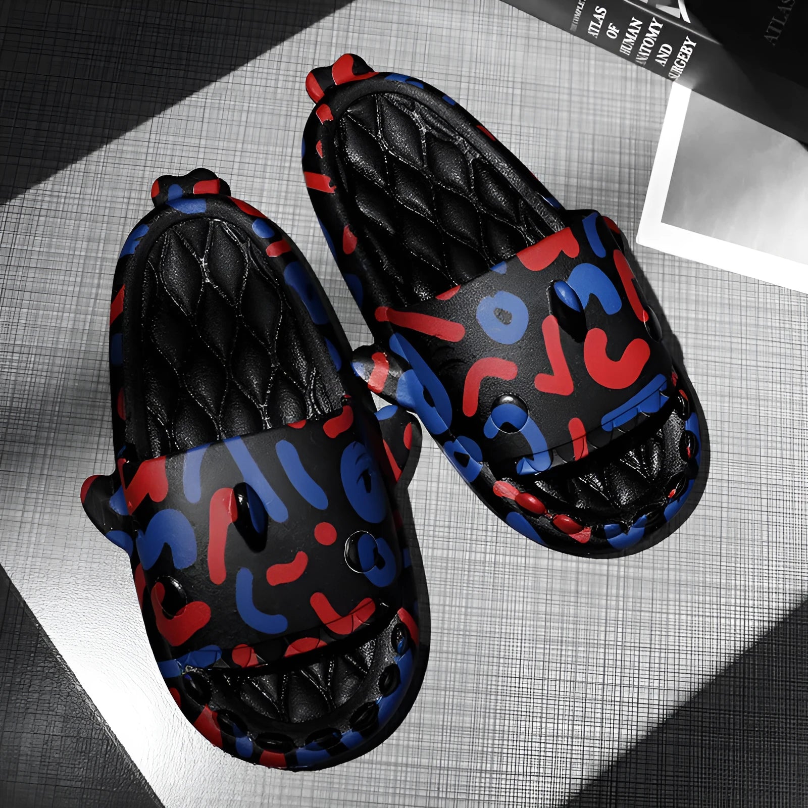 Cute shark graphic EVA open-toe home slippers for adults on a white background.