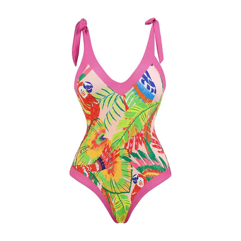 Retro pink floral print women's one-piece swimsuit with V-neck and attached thin skirt.