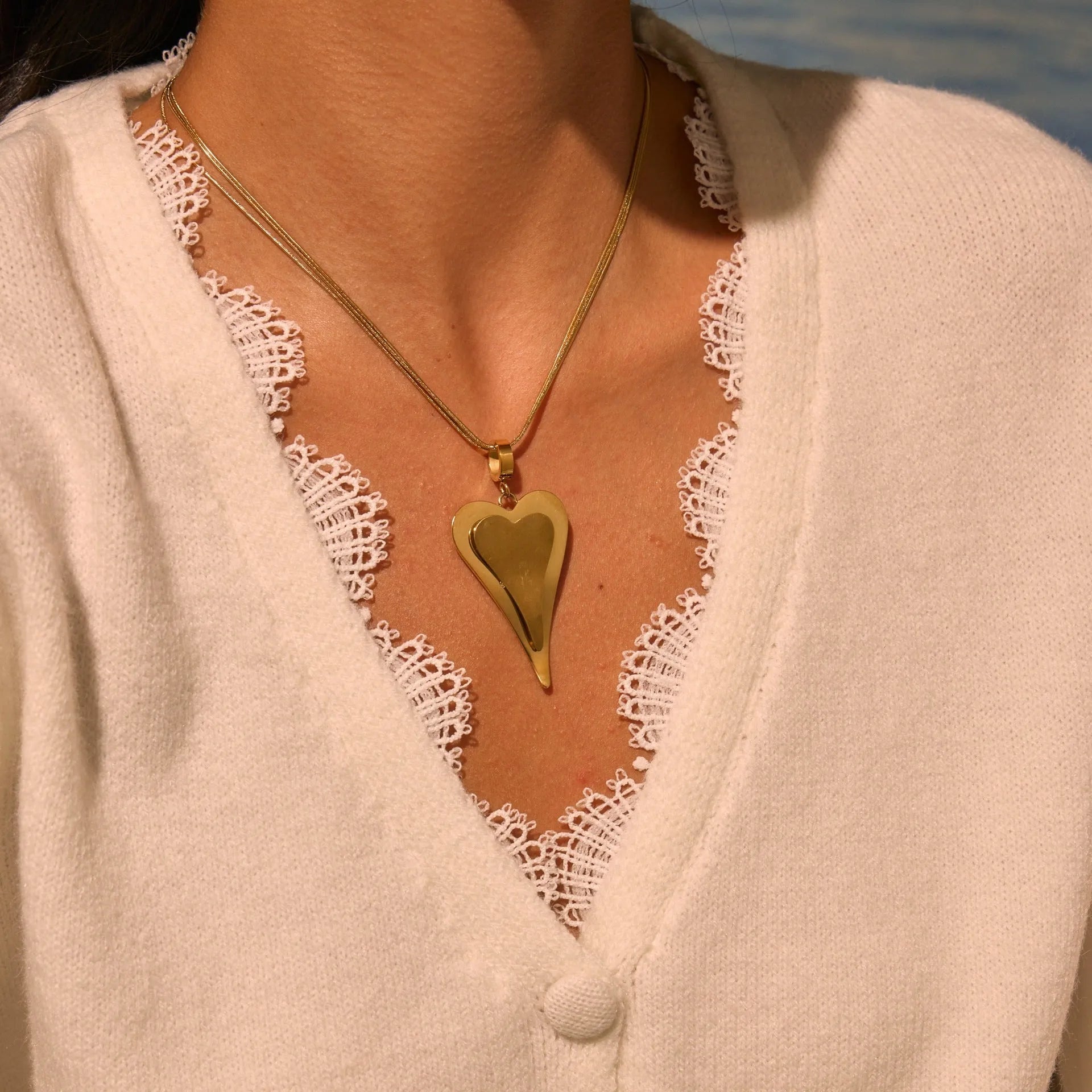 Double heart geometric pendant with snake bones chain design stainless steel necklace for women in gold or steel finish