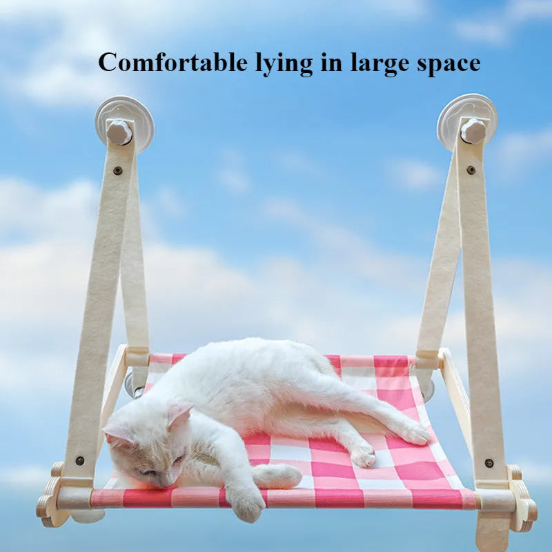 Cat window hammock with wooden frame and linen fabric, secured by four suction cups, in pink colour option