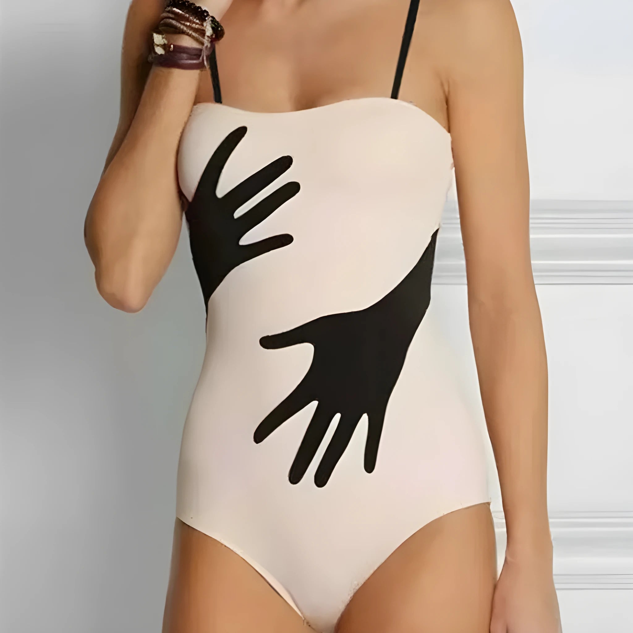 Women's one-piece bikini swimsuit with a gauze skirt overlay.