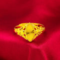 Open geometric flower ring in gold colour with textured details on brass base
