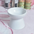 Ceramic anti-tumble pet bowl for dogs and cats with high foot and neck protector.