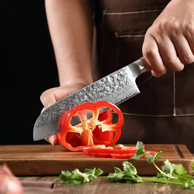 Damascus steel kitchen knife with patterned blade and Melaleuca core, 8 inch chef knife shown on cutting board
