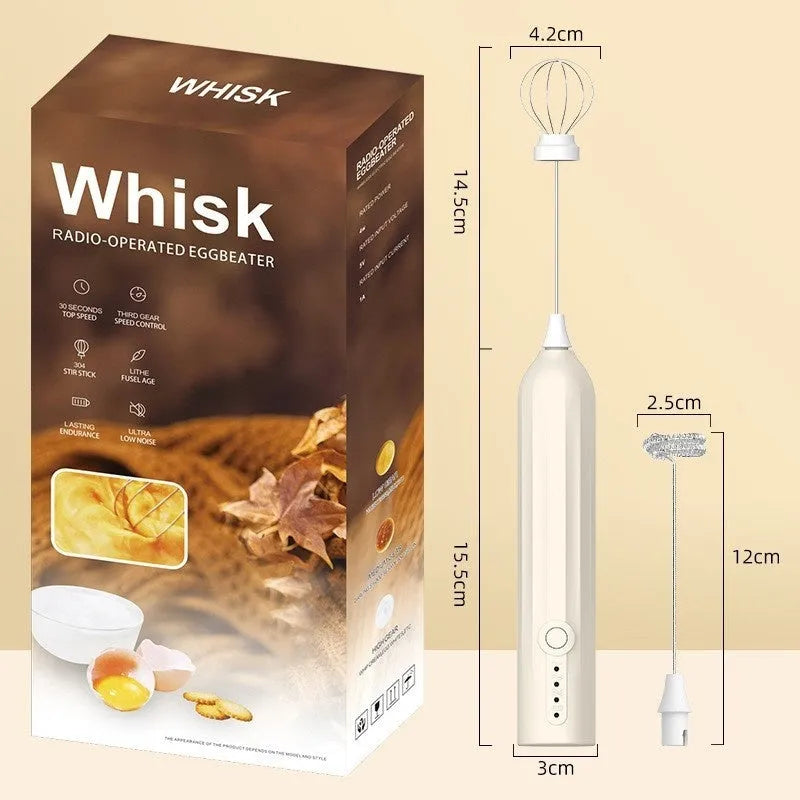 Mini handheld electric milk frother in black, with stainless steel whisk and USB charging cable.
