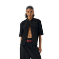 Black handmade half-sleeve hunting shirt with a shirt collar and loose fit on a mannequin.