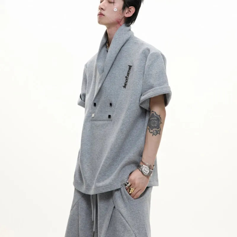 Men's dark grey V-neck cotton sports suit with padded shoulder jacket and matching shorts.