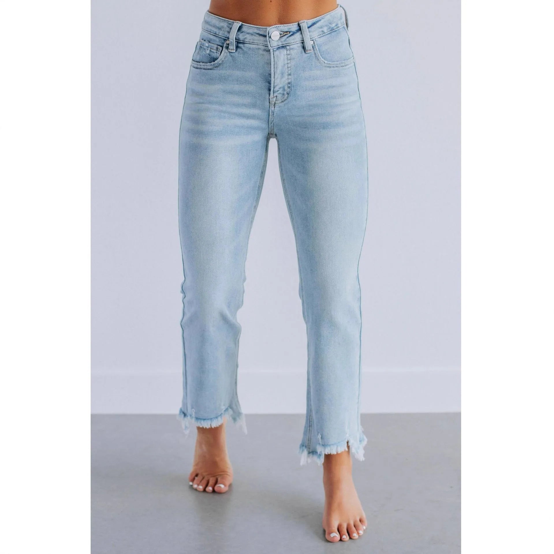 Women's casual denim jeans in solid dark blue with a hand-worn distressed finish.