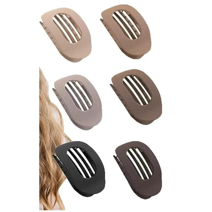 Six Rose Red plastic hair clips with a quadrilateral shape and frosted grip, laid out on a surface.