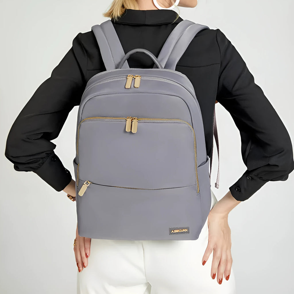 Oxford cloth women's backpack in black and purplish grey with anti-theft features and waterproof construction