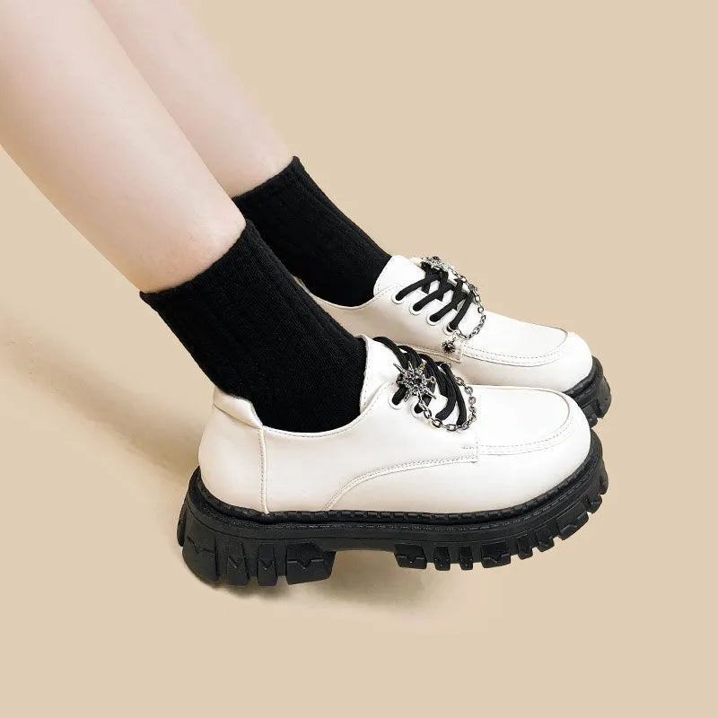 Women's preppy style loafers in Duke Asterism colour with cross shoulder strap and round toe