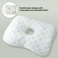 Beauty salon single hole ear pillow in grey on a treatment bed.