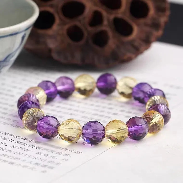 Handcrafted unisex crystal bracelet with 128-facet beads in amethyst, available in multiple bead diameters.