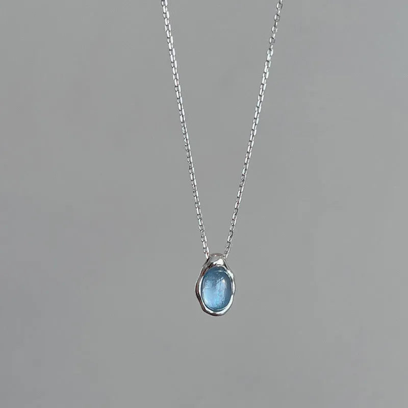 Navy blue water drop necklace with geometric pendant on cross chain, adjustable 41-50cm length
