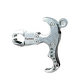 Close-up of a zinc alloy archery release aid showing the harpoon clip and trigger mechanism.