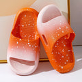 Gradient blue PVC slippers for children on a white background.