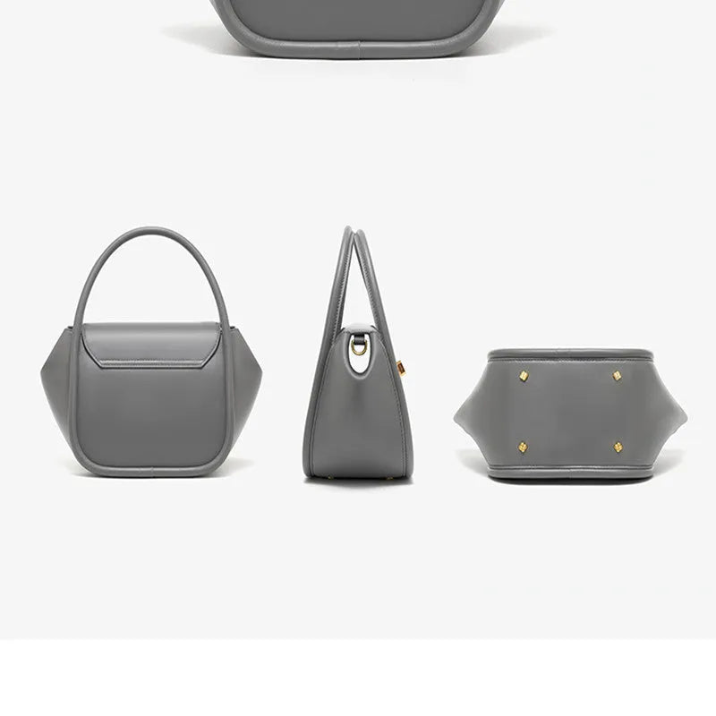 Women's wing-shaped cow leather tote handbag with a buckle closure in a choice of four colours.