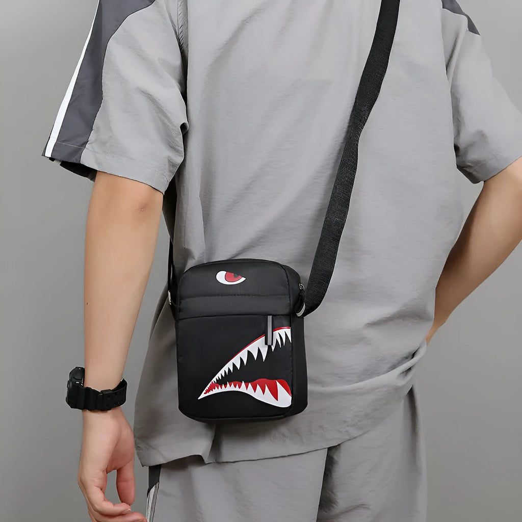 Men's small casual crossbody bag in Oxford cloth, shown in black with adjustable strap and animal print lining visible.
