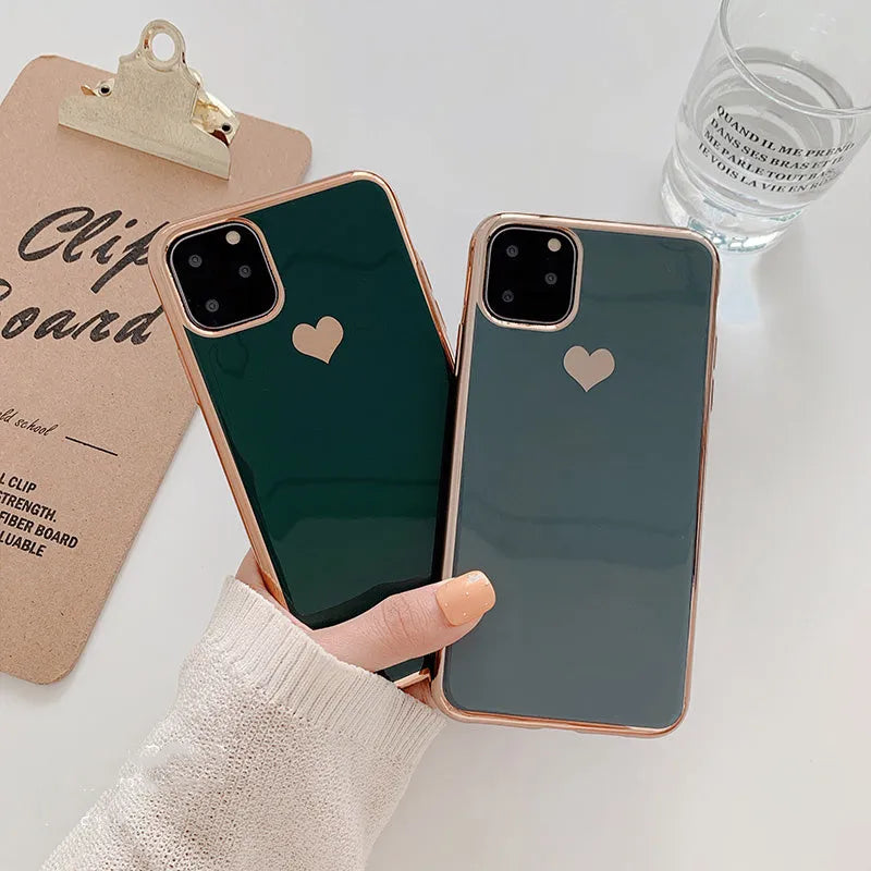Solid colour blue TPU iPhone back cover case shown next to a claret pink and green version.