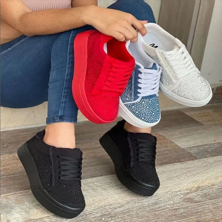 Women's black lace-up casual sports shoes with rhinestone detail on the side and a chunky rubber sole.