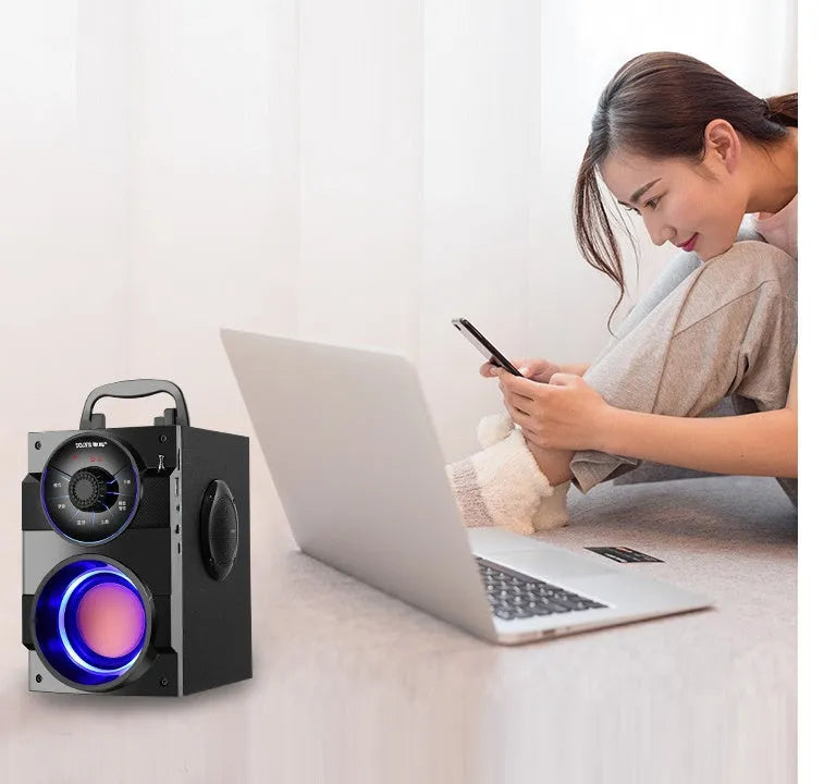 Black portable mini home audio speaker system with subwoofer and 3.5mm audio cable