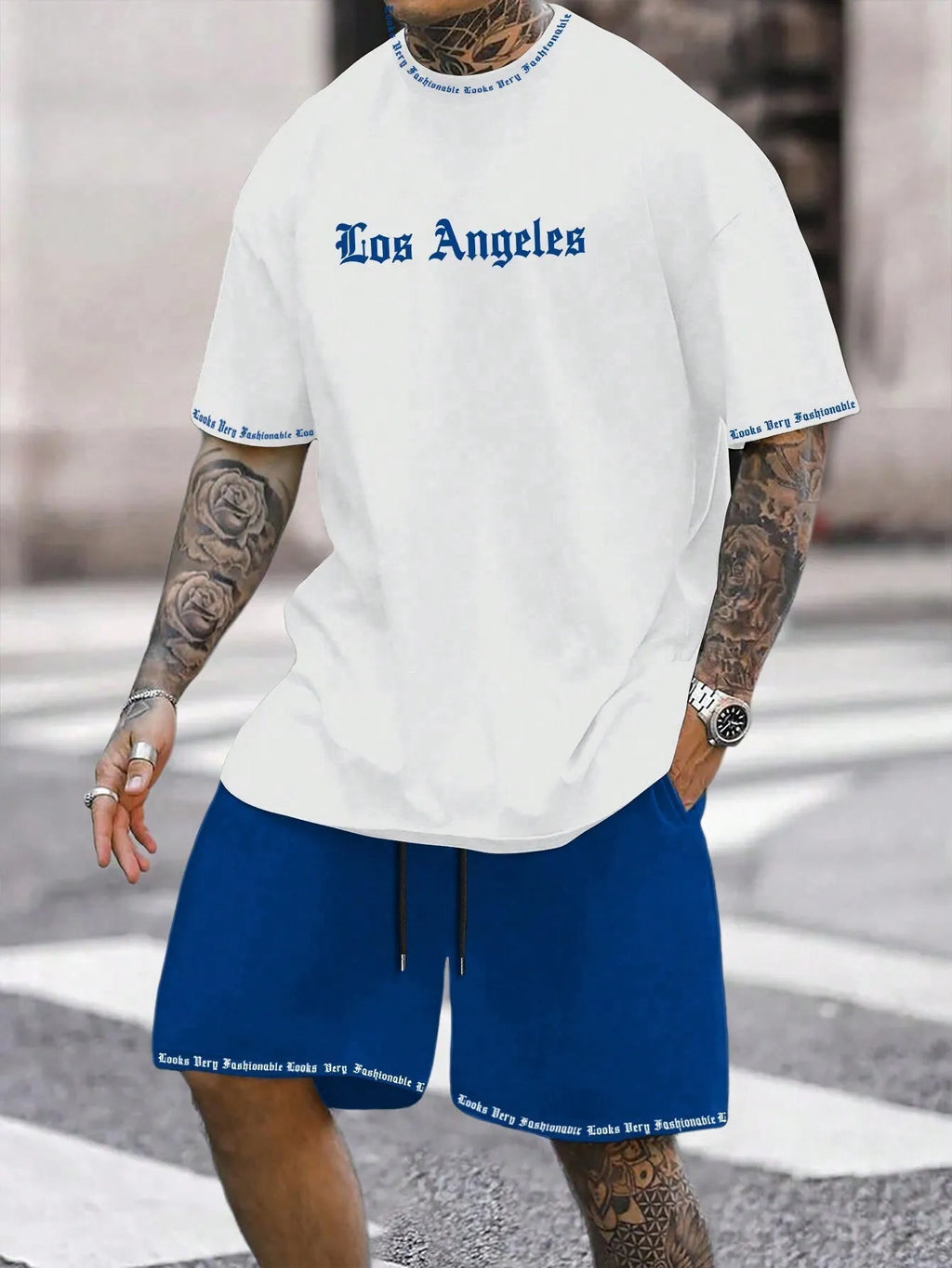 Men's navy blue printed short-sleeved top and matching shorts sports set on a white background