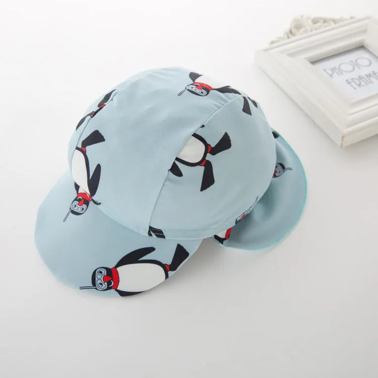 Boys' long sleeve penguin print swimsuit two-piece set with matching swimming cap