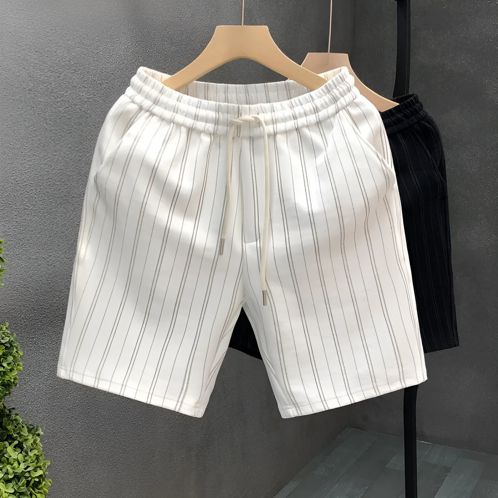Men's black and white striped fleece-lined shorts with elastic waistband