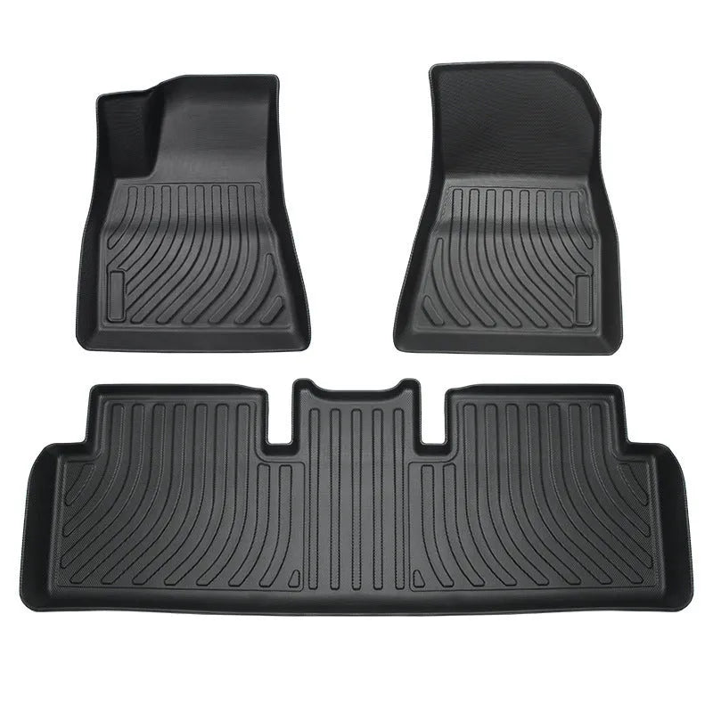 Set of black rubber floor mats for a Tesla car interior