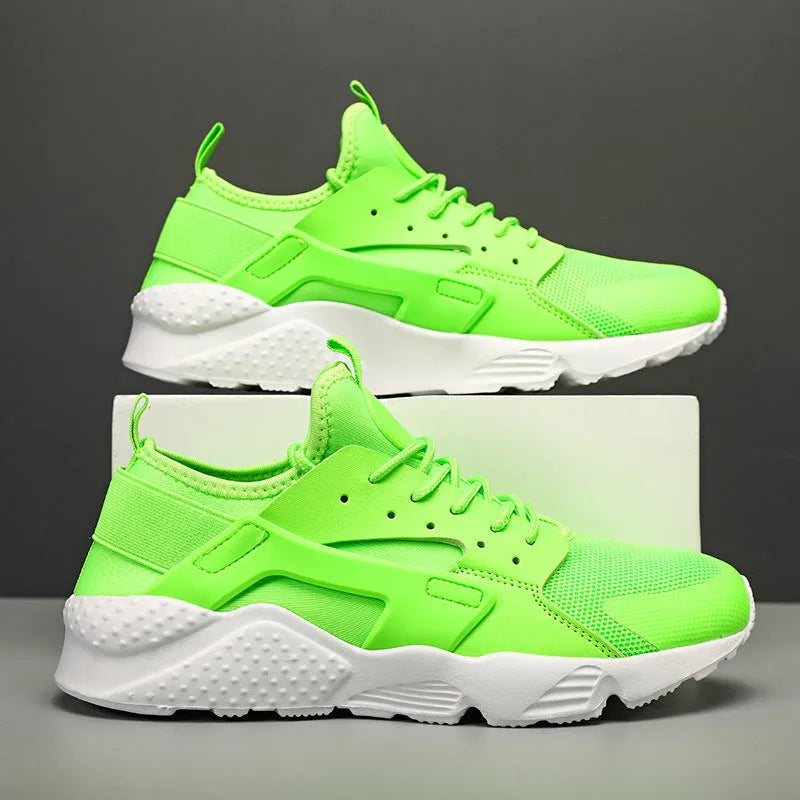 Men's green low-top casual shoes with mesh upper and cross shoulder straps on a flat sole.